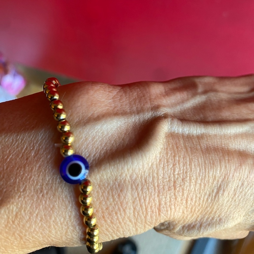 Stretch Brass and blue evil eye bead bracelet for protection 8 inches